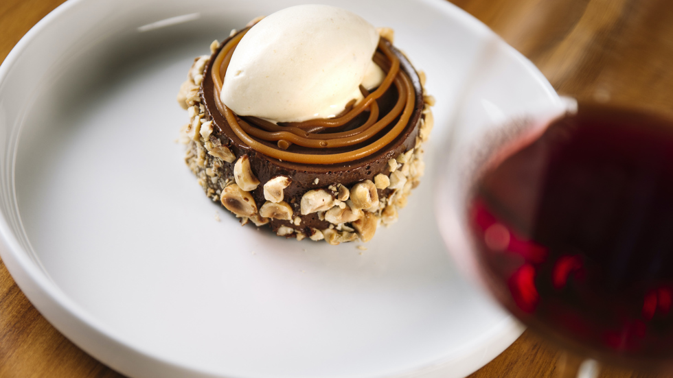 A chocolate delice tart and red wine served at Punga Cove in the Marlborough Sounds, New Zealand.