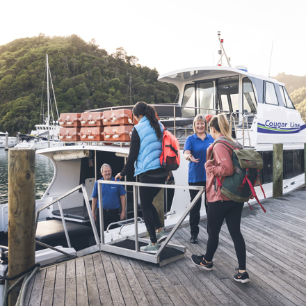 Cougar Line passengers board their boat in Picton Marina in the Marlborough Sounds, New Zealand.